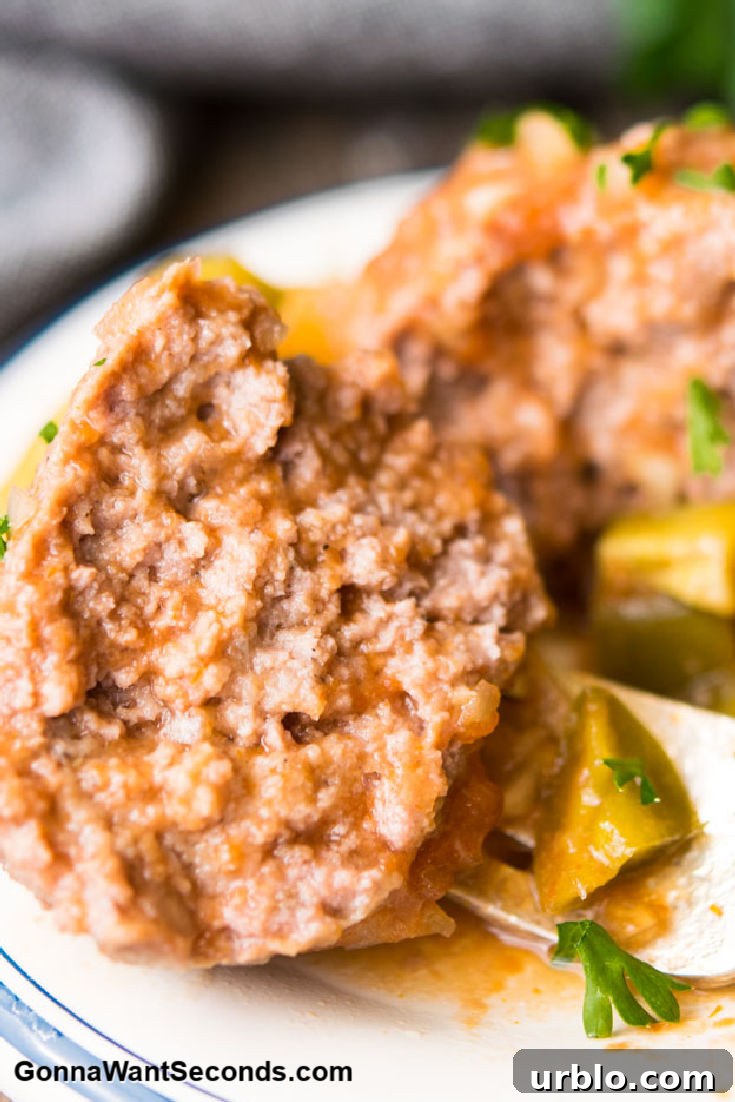 sweet and sour meatballs cut in half, close up 