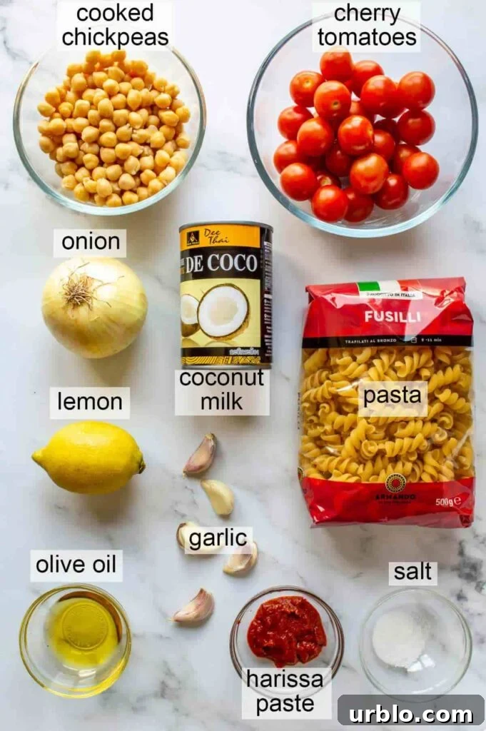 10 ingredients with labels: chickpeas, cherry tomatoes, onion, lemon, olive oil, coconut milk, garlic, harissa paste, salt, pasta