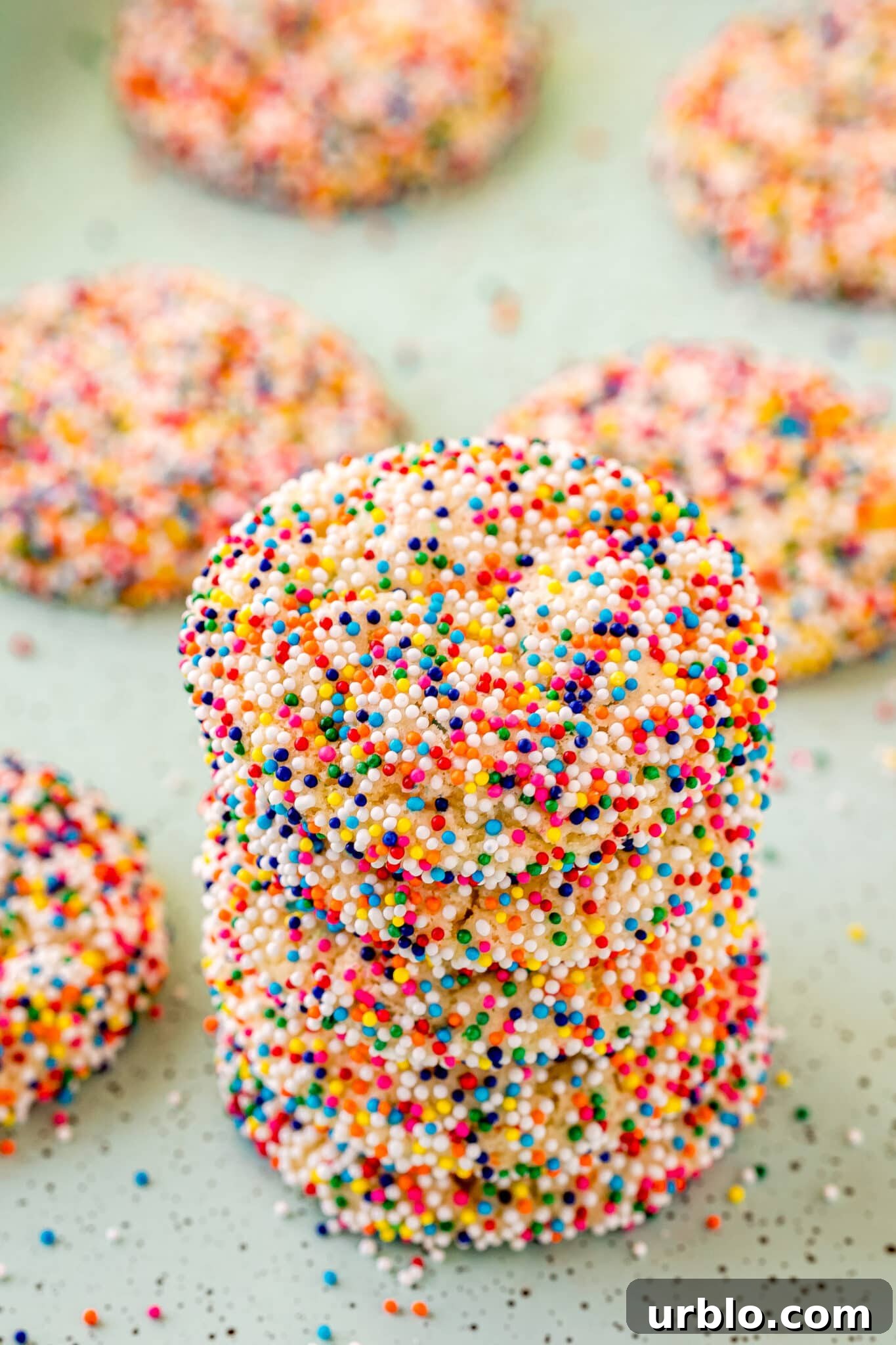 funfetti cake mix cookies stacked on table