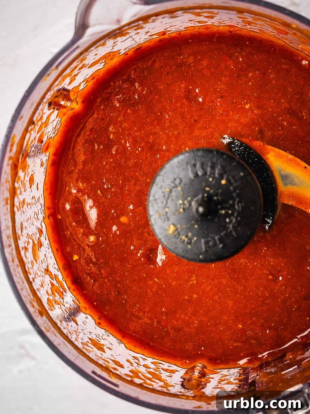 Food processor with the finished chipotle hot sauce.