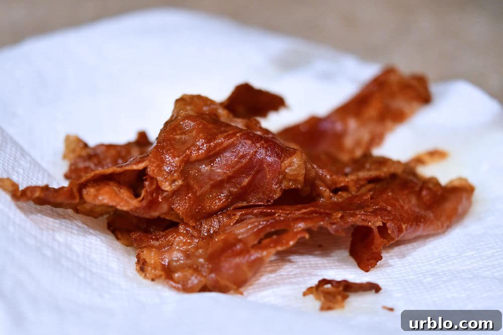 Crispy Prosciutto and Mushroom Pasta Dinner Recipe 4 24Bite: Prosciutto ham just fried and resting on paper towel