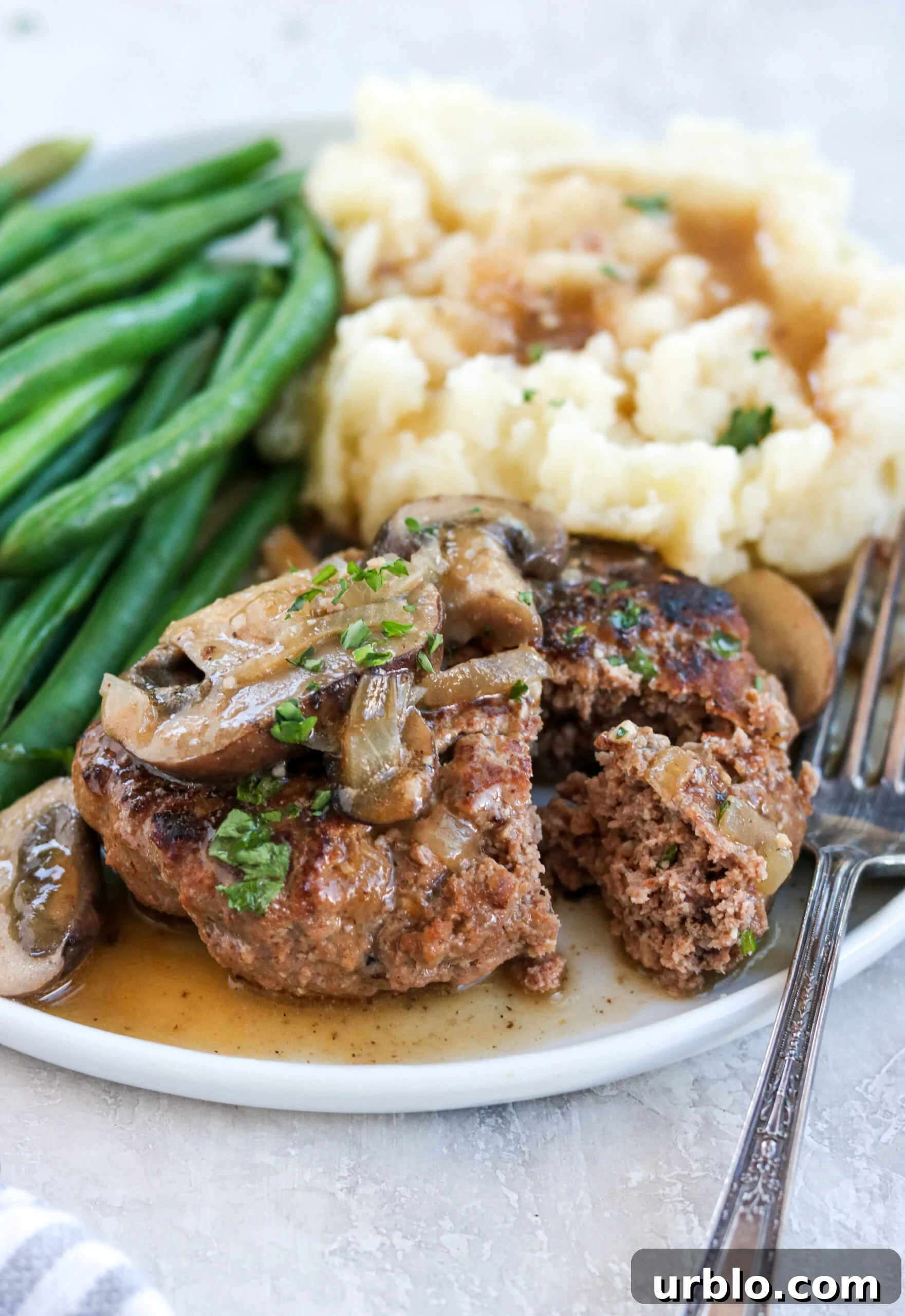 Paleo Salisbury steak with mushroom gravy, mashed potatoes, and green beans