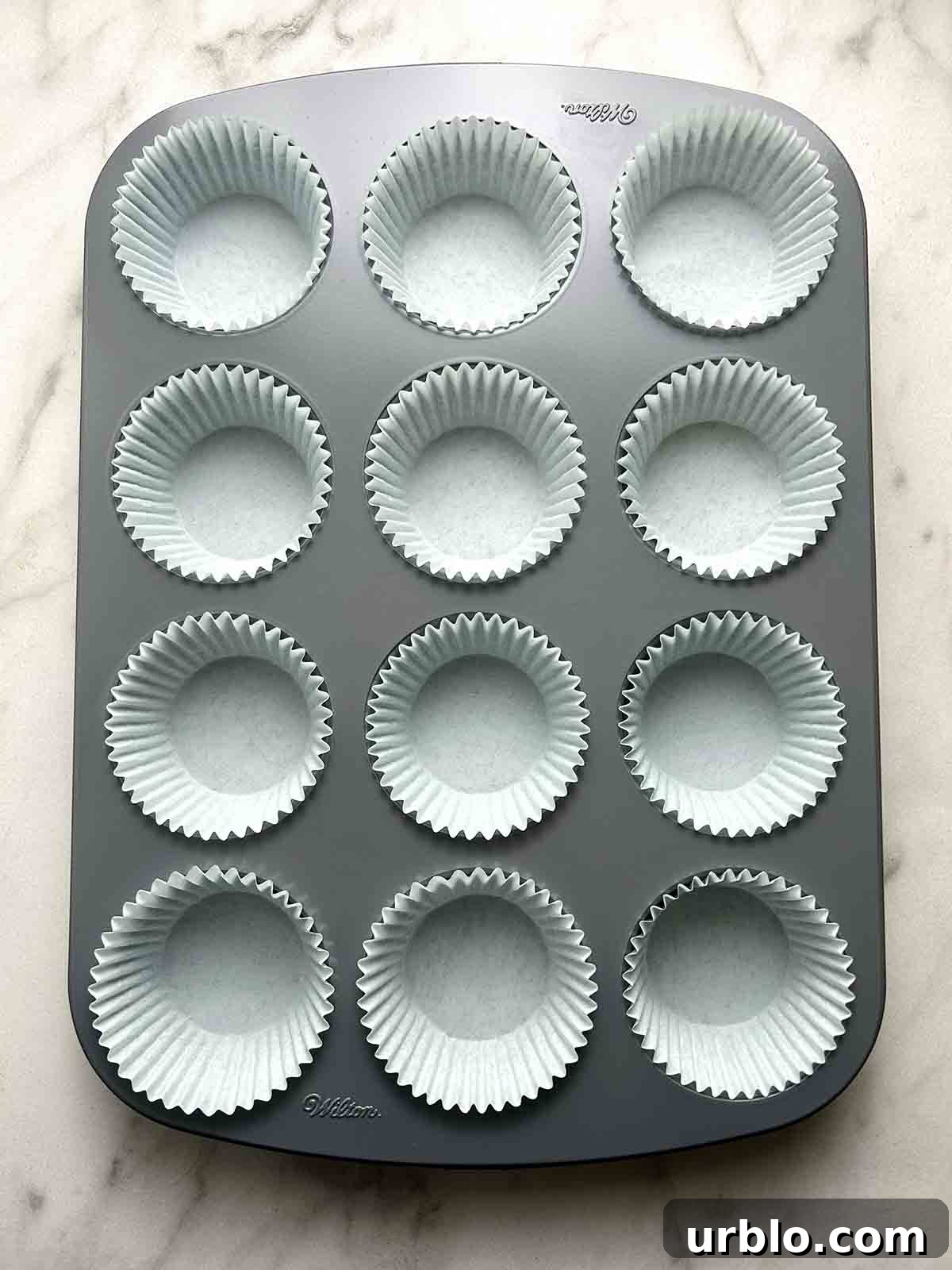 empty paper liners in muffin tray