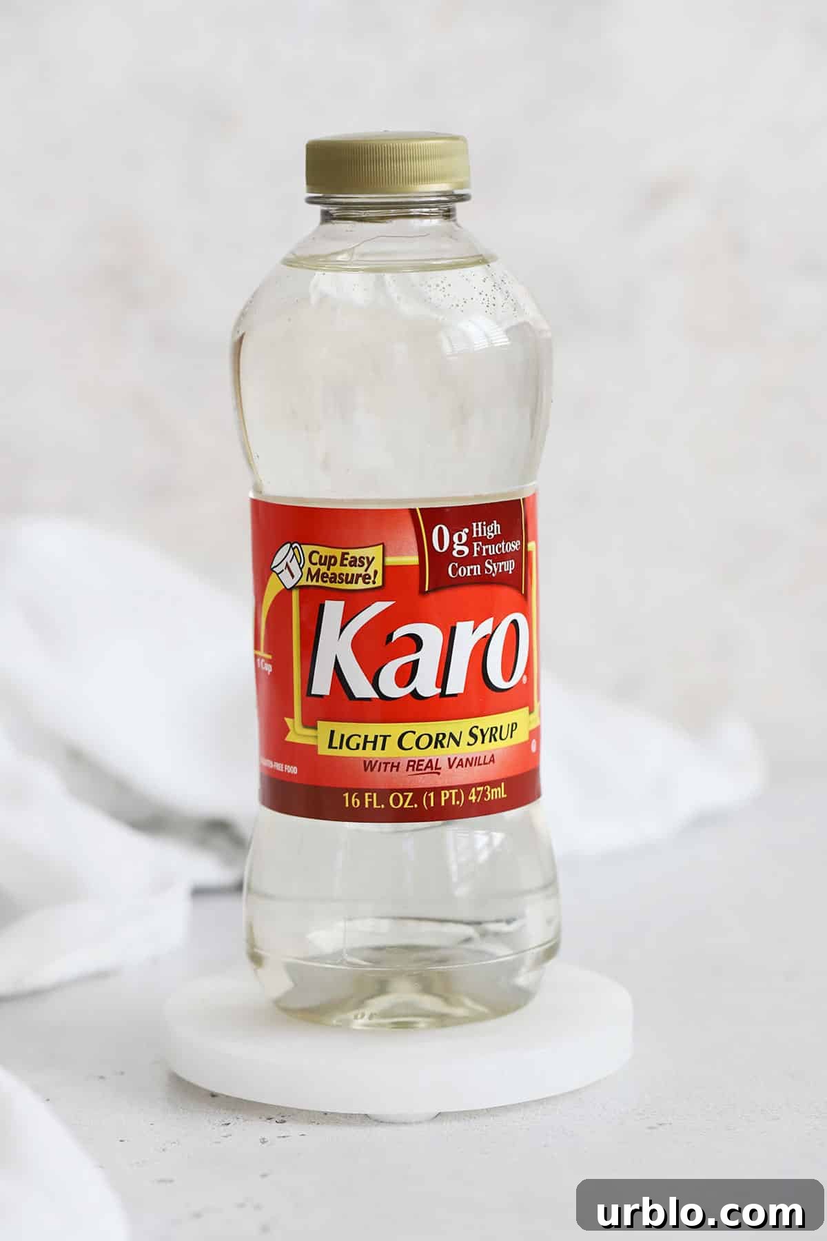a bottle of light corn syrup on a white background