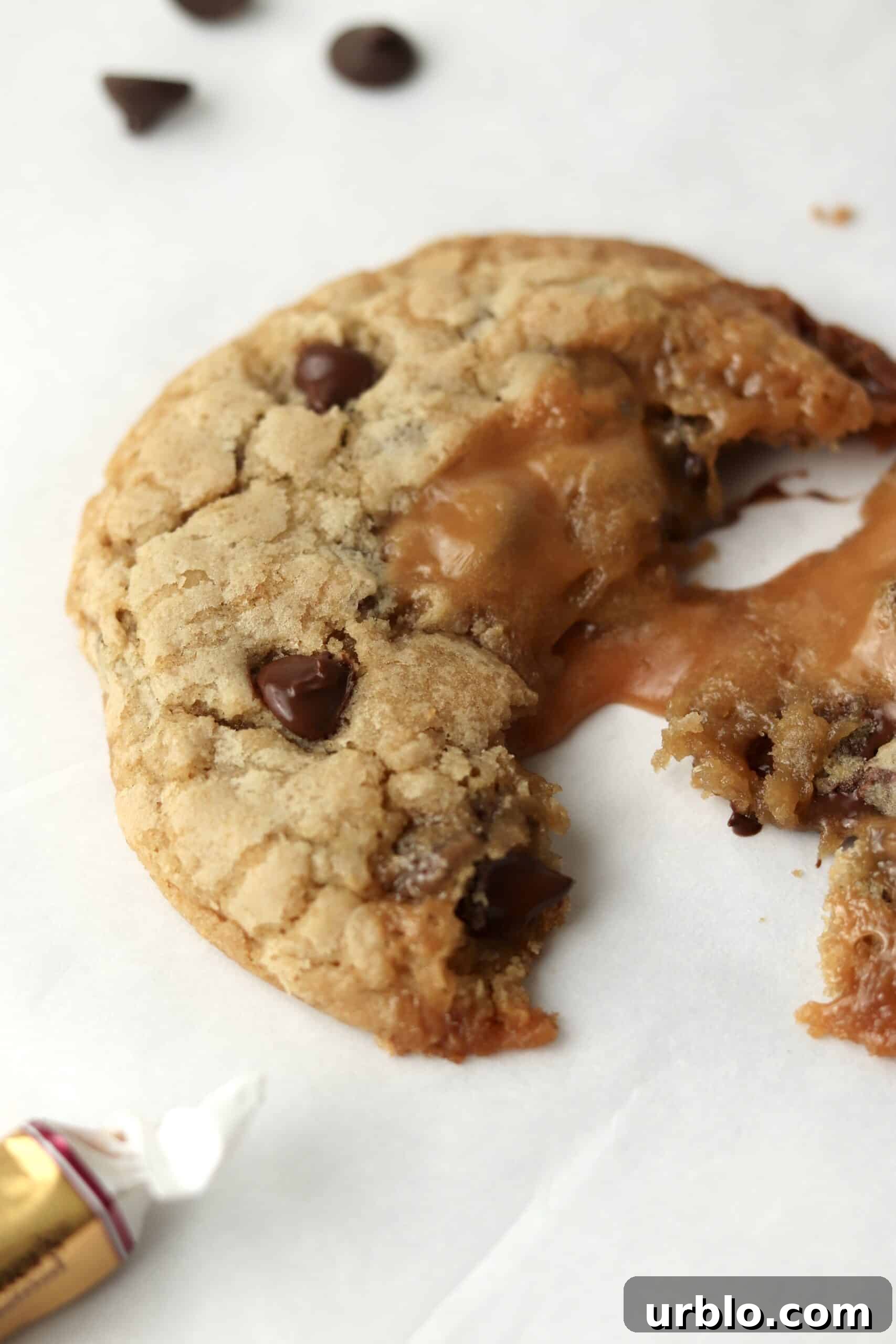 gooey chocolate chip cookie with caramel oozing out