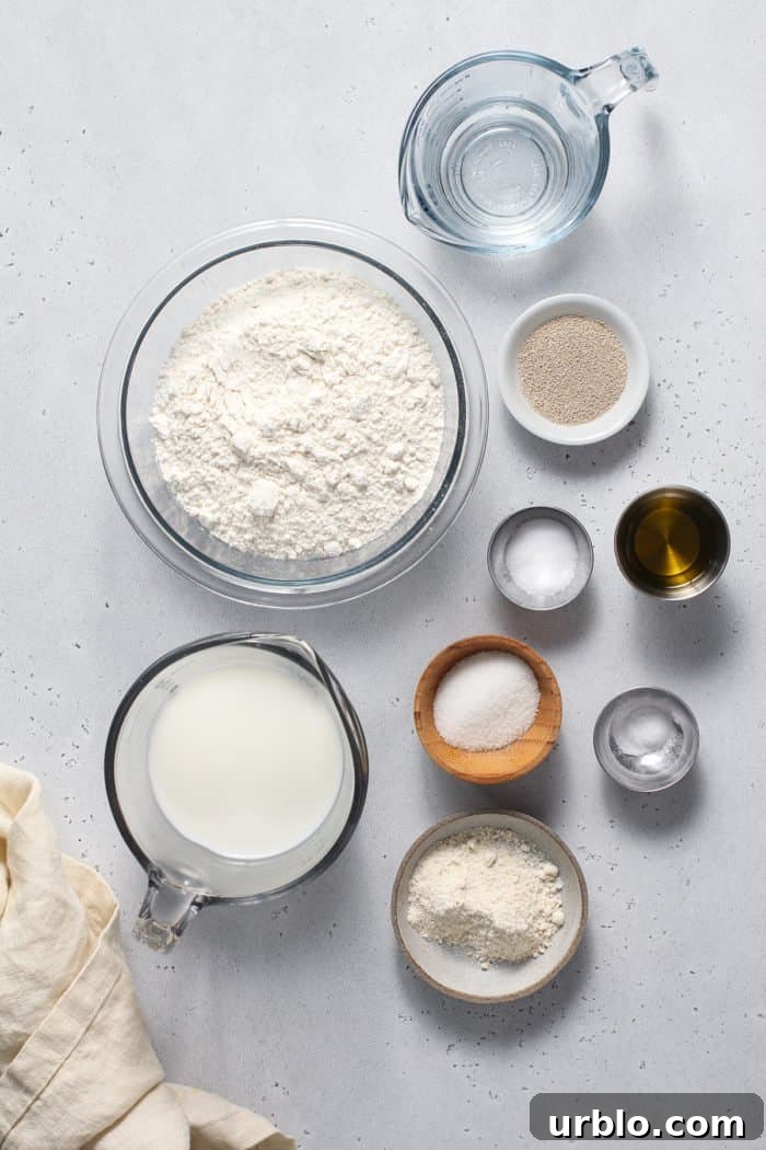 English muffin bread ingredients arranged on a light countertop