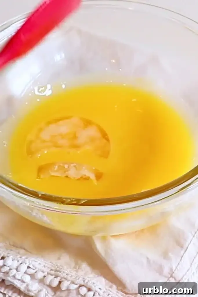 Silky Lemon Mousse Recipe with Fresh Citrus Zest 11 adding the bloomed gelatin to the hot yolk and lemon juice mixture