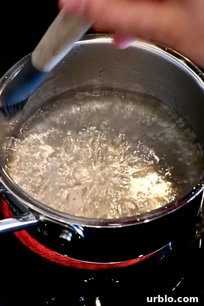 Silky Lemon Mousse Recipe with Fresh Citrus Zest 14 brushing the side of the saucepan with water while heating the sugar and sugar to make hot syrup
