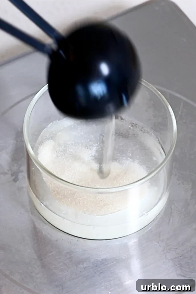 Silky Lemon Mousse Recipe with Fresh Citrus Zest 7 adding cold water to gelatin powder in a cup