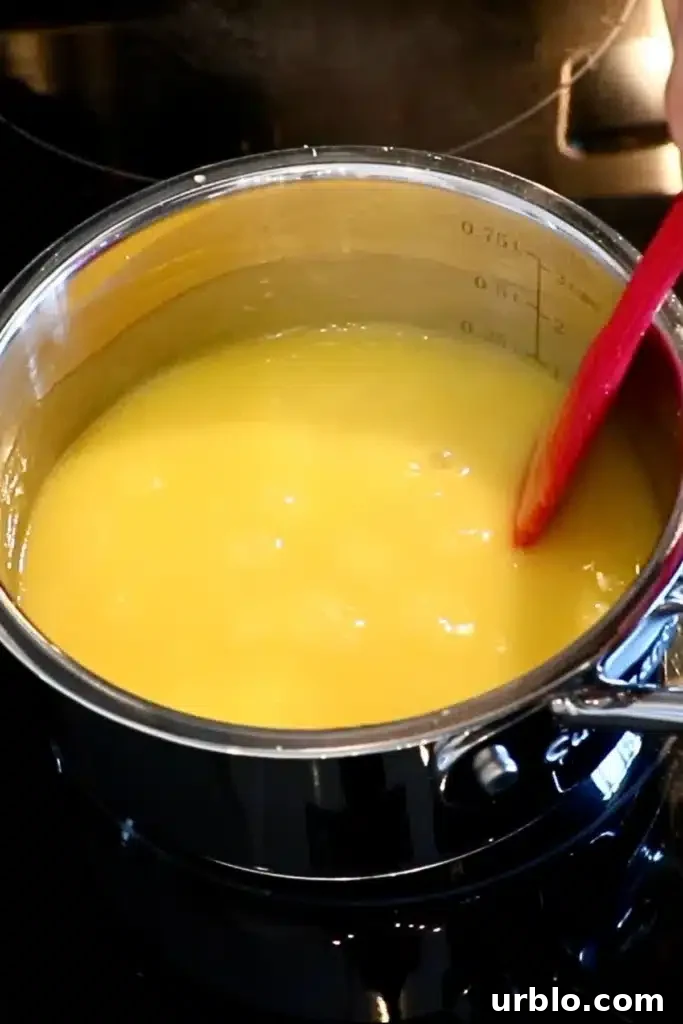 Silky Lemon Mousse Recipe with Fresh Citrus Zest 9 heating the yolk and lemon juice mixture in a saucepan
