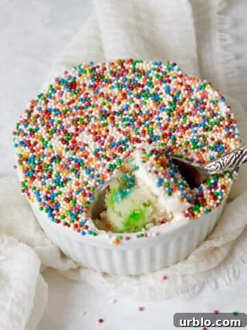 Single serve dot cake with nonpareils in a ramekin.