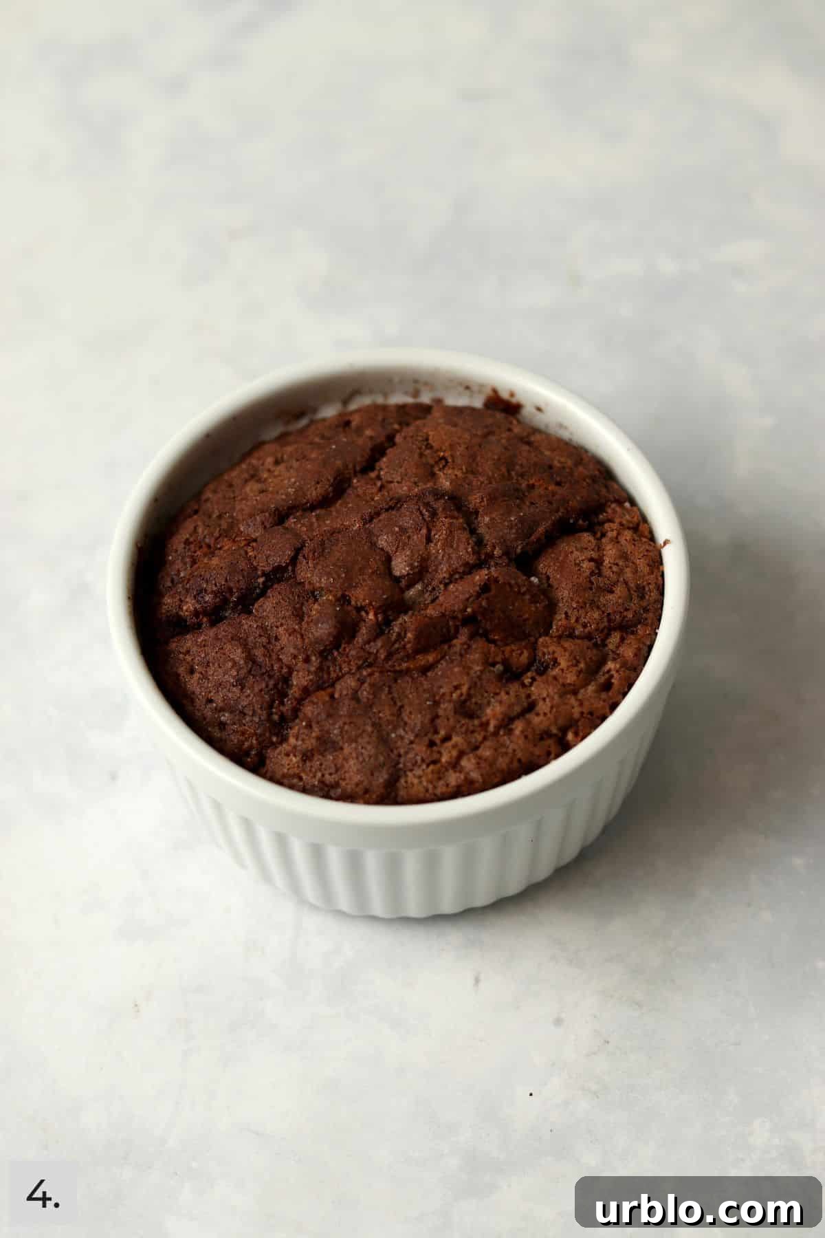 Single-Serve Cinnamon Swirl Banana Bread for One 7 Baked single serve cinnamon swirl banana bread in a ramekin.