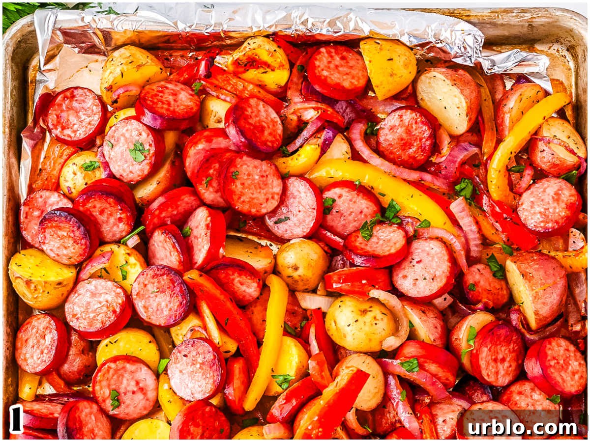 Sheet Pan Smoked Sausage with Roasted Potatoes 8 The finished sheet pan meal garnished with parsley.
