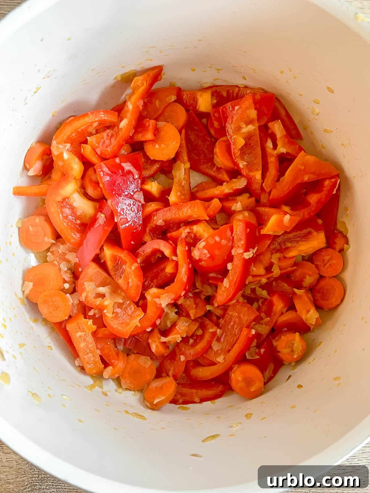 Vegan Thai Red Curry (Paleo-Friendly) 5 Bell peppers and carrots in a pan.