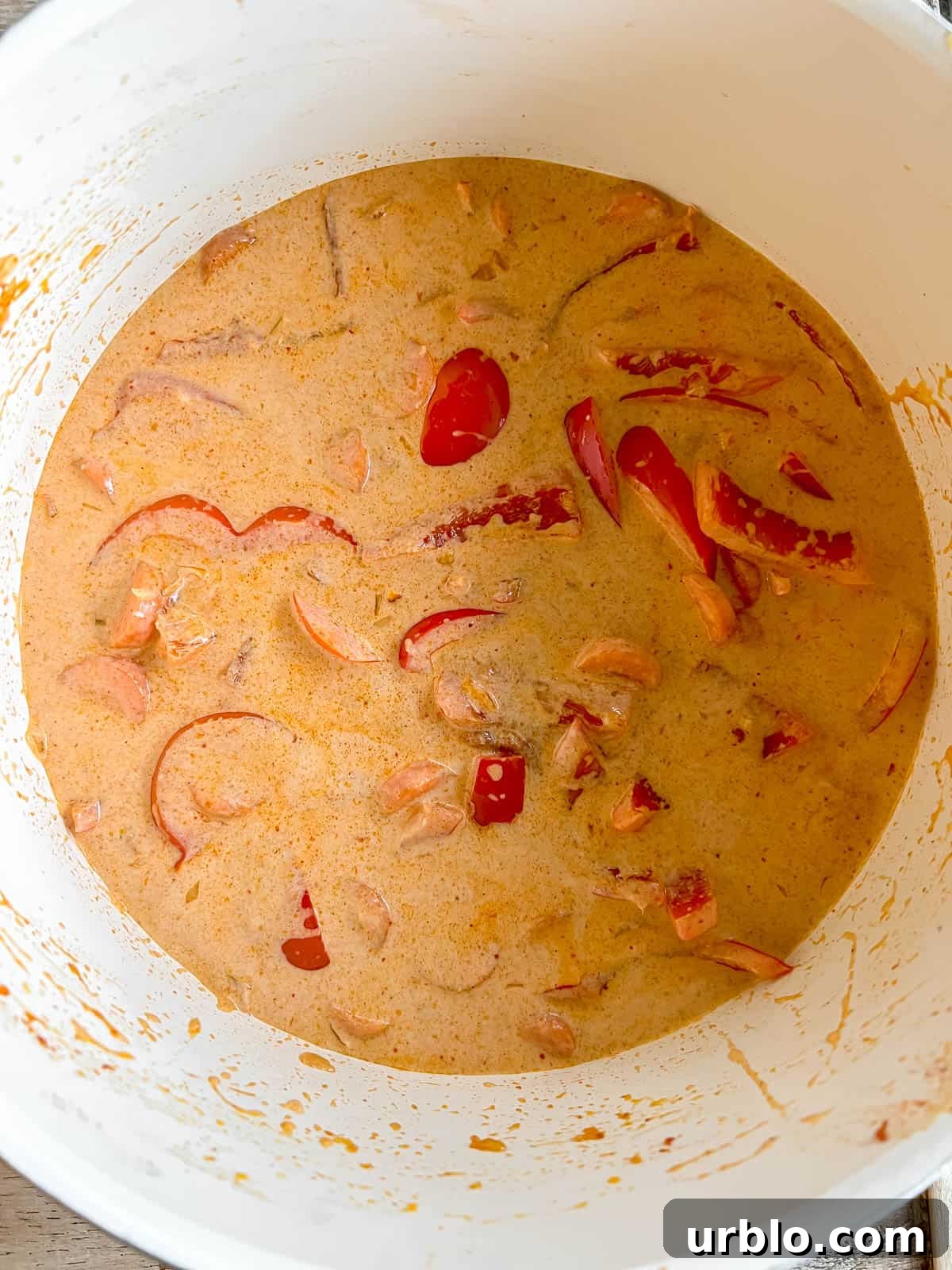 Vegan Thai Red Curry (Paleo-Friendly) 7 Coconut cream added to the pan.