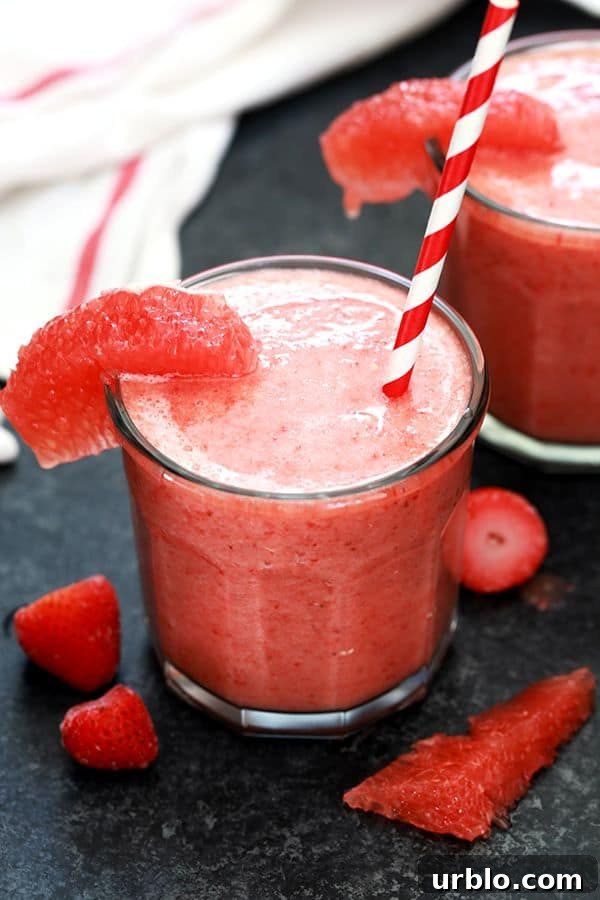 This four ingredient Strawberry Grapefruit Smoothie couldn't be easier! A ruby red grapefruit, strawberries, banana and orange juice are blended together in just seconds to create the perfect easy breakfast or snack. This four ingredient Strawberry Grapefruit Smoothie couldn't be easier! A ruby red grapefruit, strawberries, banana and orange juice are blended together in just seconds to create the perfect easy breakfast or snack.