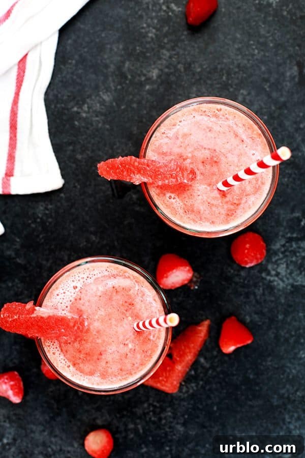This four ingredient Strawberry Grapefruit Smoothie couldn't be easier! A ruby red grapefruit, strawberries, banana and orange juice are blended together in just seconds to create the perfect easy breakfast or snack. This four ingredient Strawberry Grapefruit Smoothie couldn't be easier! A ruby red grapefruit, strawberries, banana and orange juice are blended together in just seconds to create the perfect easy breakfast or snack.