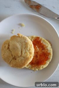 gluten free biscuits split topped with jelly.