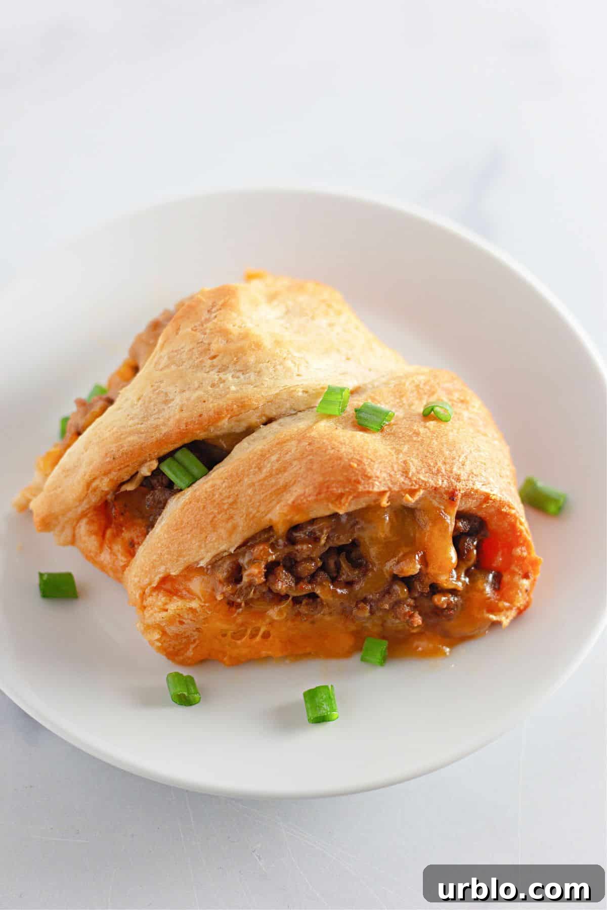 Cheesy Taco Ring with Crescent Roll Crust 9 two slices of taco crescent ring on a plate.