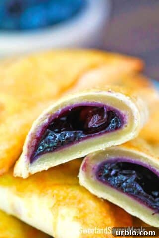 blueberry hand pie sliced in half