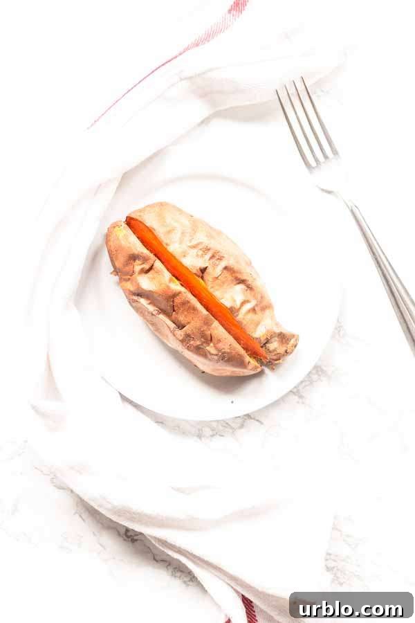 Crispy Baked Sweet Potatoes in the Air Fryer 5 baked sweet potato in Air Fryer on white plate