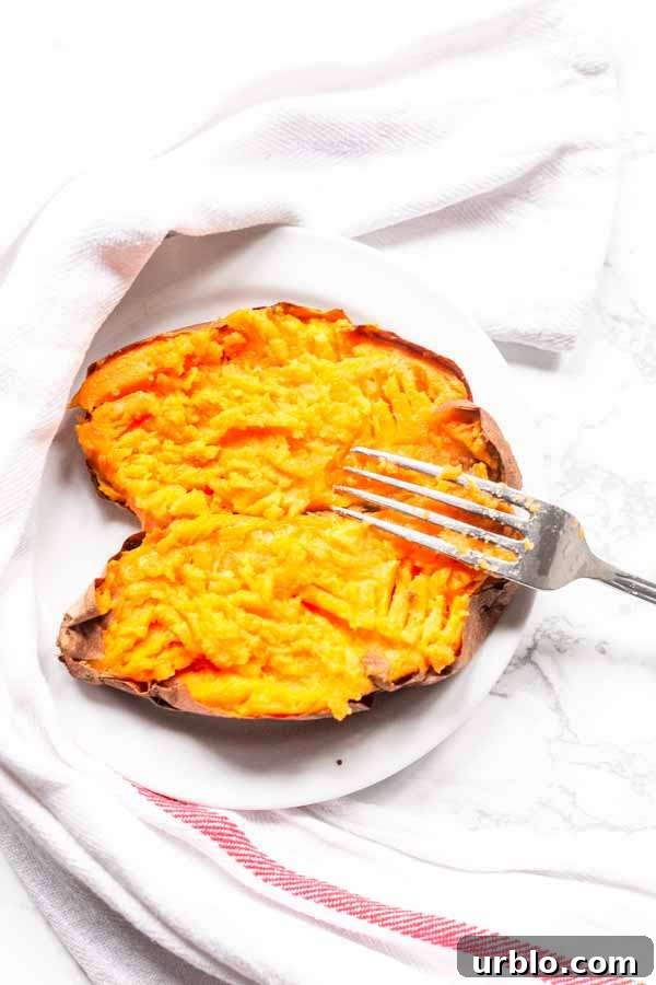 Crispy Baked Sweet Potatoes in the Air Fryer 9 baked sweet potato in Air Fryer on a white plate