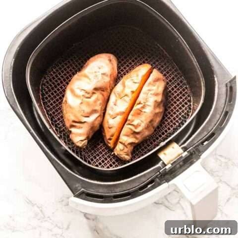 baked sweet potato in Air Fryer basket