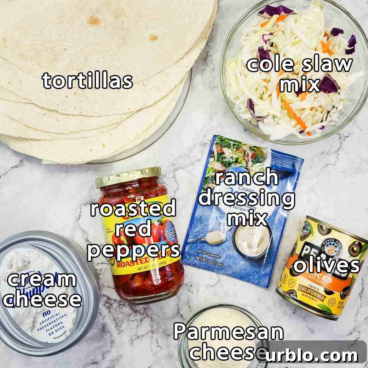 Creamy Ranch Pinwheels with Roasted Red Peppers Appetizer 3 Overhead shot of ingredients - tortillas, cole slaw mix, roasted red peppers, cream cheese, ranch dressing mix, olives, and parmesan cheese.